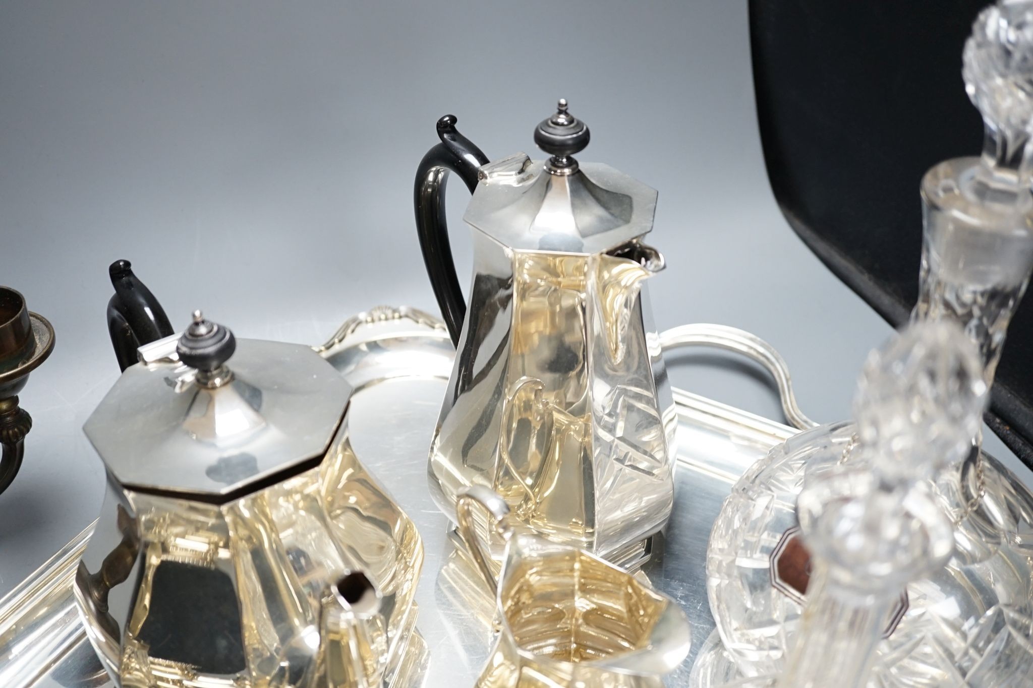 A quantity of silver plated tea/coffee wares including two handled tray, decanters, salts etc., 62cm